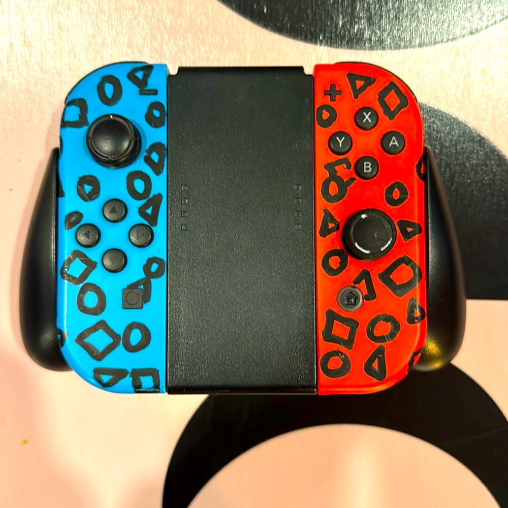 Two Nintendo switch Joy con controllers. (black holder not included)
